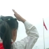 4K实拍小学生在国旗下敬礼视频素材