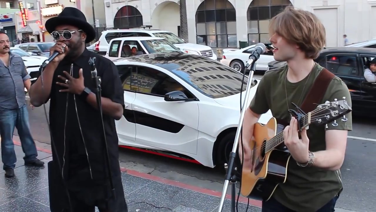 i.am surprises street performer