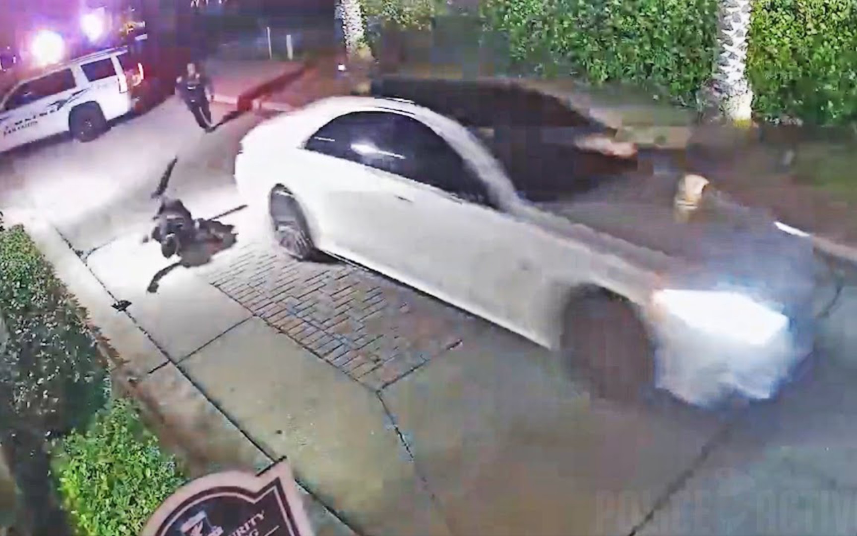 Surveillance Video - U.S. police officer hit by car thief's car while enforcing the law