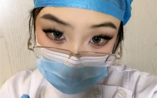 Nurse in drag. Ha-ha-ha-ha. A parody. Guess who.