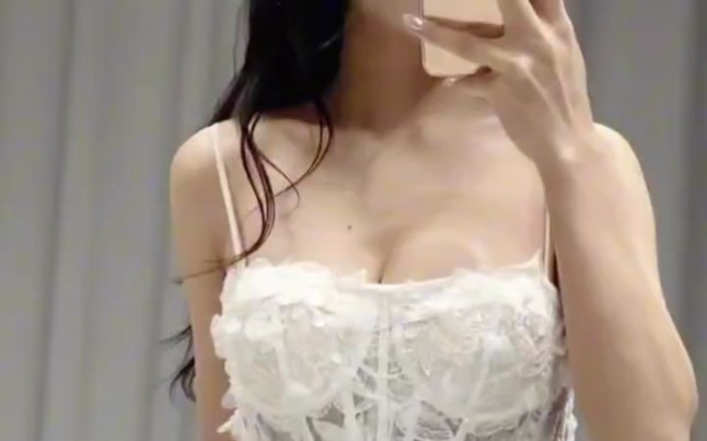 Vines wrap around the skirt and flowers bloom.