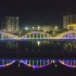 航拍茂名化州市夜景灯光水秀喷泉
