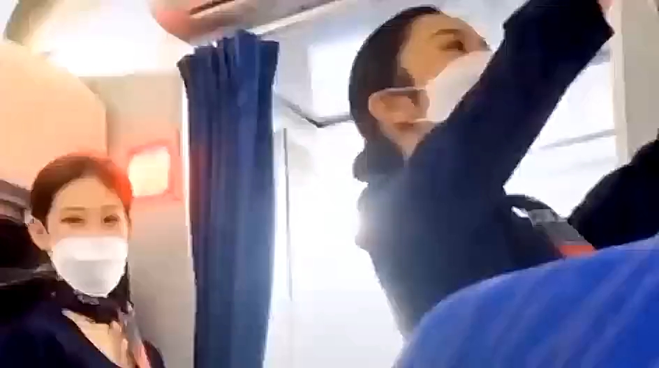 Caught filming a stewardess.
