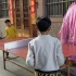 大儿子和二儿子和他老叔来一场双打乒乓球比赛。
