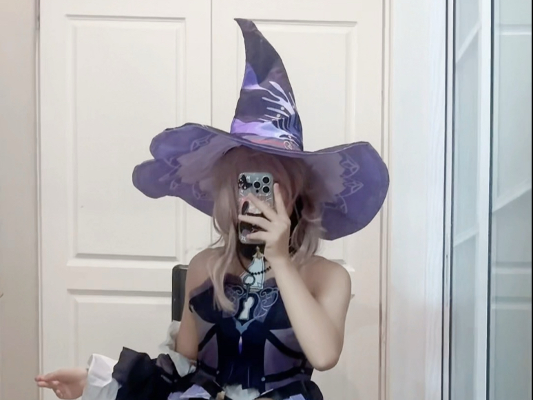 What's with the pointy hat on the little black tower?