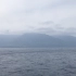 远眺日本屋久岛，从海平面直达2000米的雪线，植被层次分明，手机拍不出效果