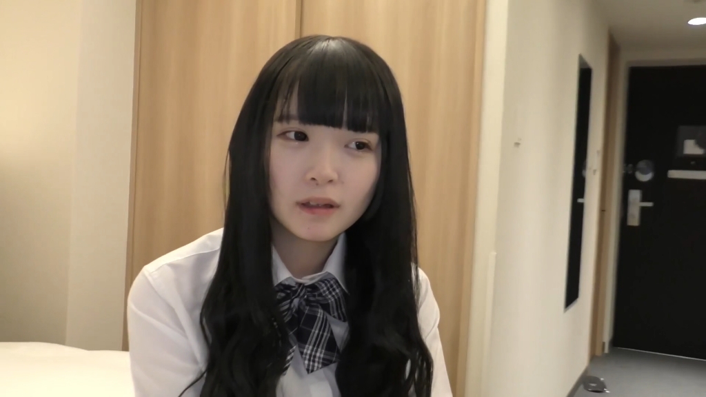 Who is the young girl in the white shirt and black skirt?