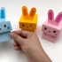 今天我们来制作一个折纸蹦跳兔子玩具！