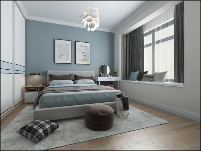 卧室:卧室的背景墙是刷成了雾霾蓝色,靠着飘窗的地方放置梳妆台