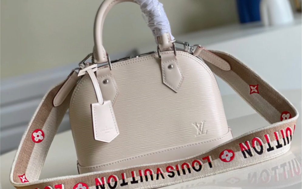 说一下高仿lv路易威登m40302乳白 alma bb 手袋 水波纹贝壳包压花小号