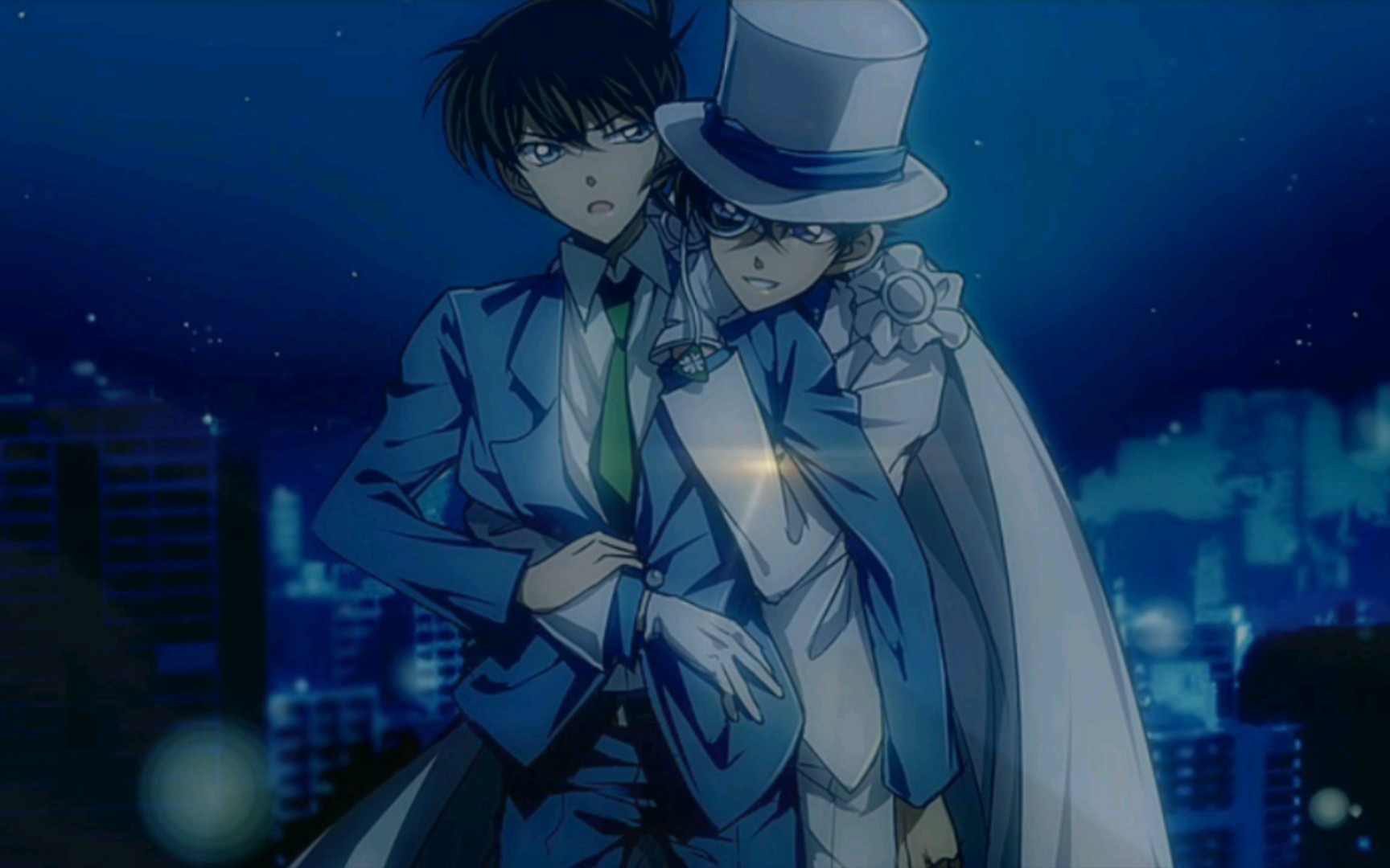 怪盗基德给柯南过生日……还从高楼大厦奋不顾身的跳下去救柯南……这