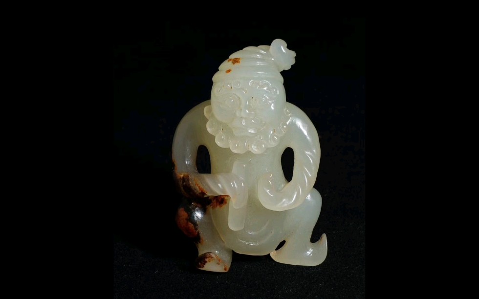 玉质一流,羊脂白玉,沁色自然,脚的雕法来看,唐代玉器的特点