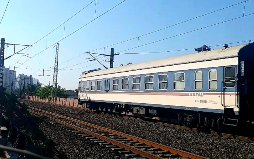 沈局辽段ss9g牵引北京开往齐齐哈尔的t39次通过天津站4号楼,尾部加挂