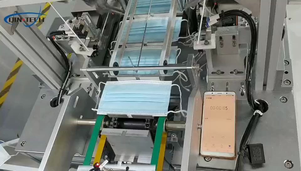 计时1分钟看秦泰盛全自动平面一拖一口罩机每分钟96片成品不信你数数