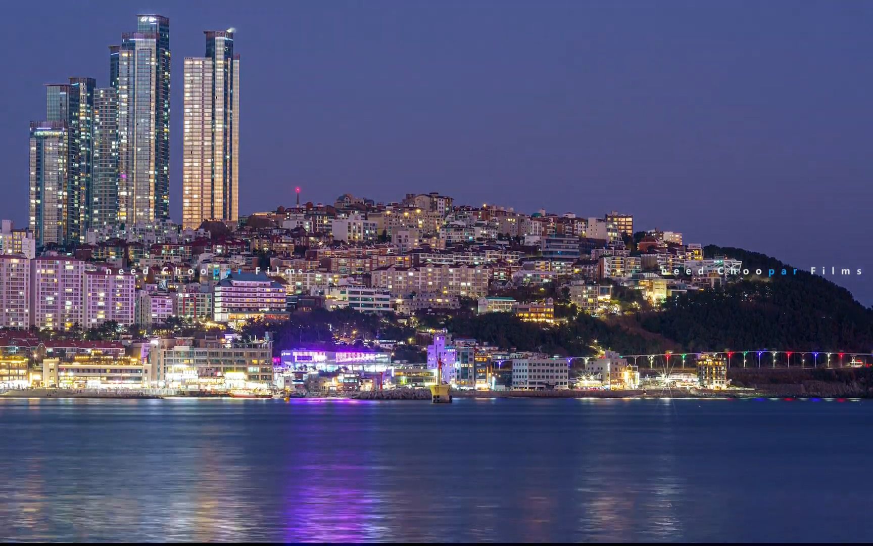 釜山城市海雲臺海灘白天到夜晚 摩天大樓夜景燈光