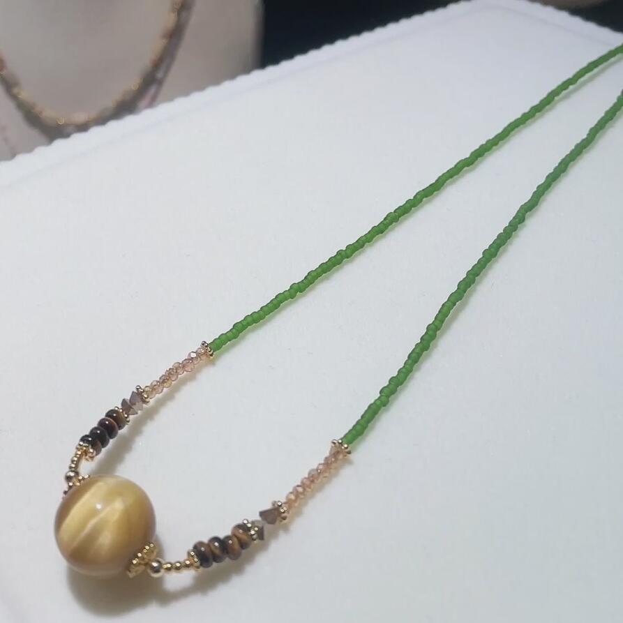 金虎眼毛衣链